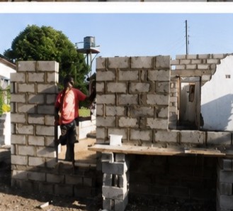 Bricklayer setting concrete blocks