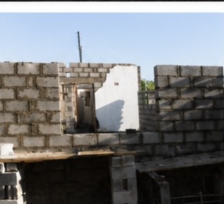 Block walls rising on a new structure
