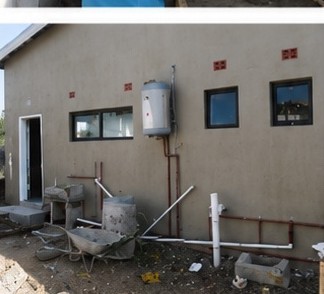 Geyser and plumbing installation on a finished wall